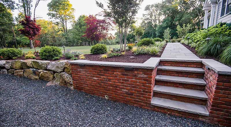 A stone and brick retaining wall to prevent soil erosion