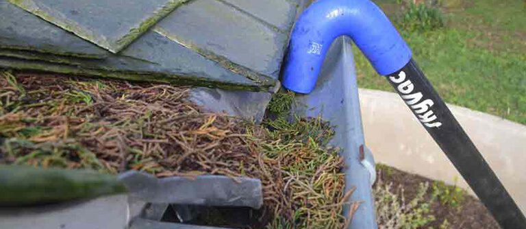 Professional gutter cleaning using a Skyvac