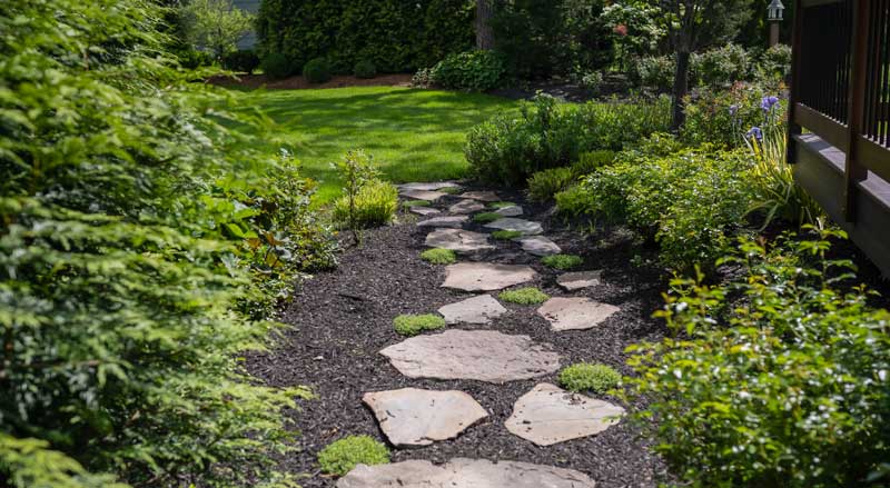 A garden path and plantings create rhythm design element.