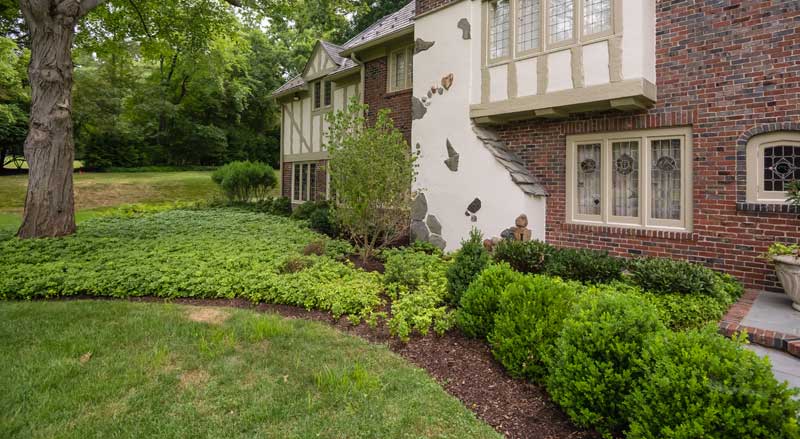 A Tudor style home with attractive landscaping