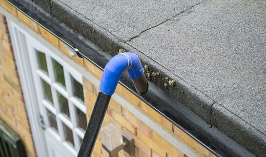Skyvac gutter cleaning machine being used to clean a gutter
