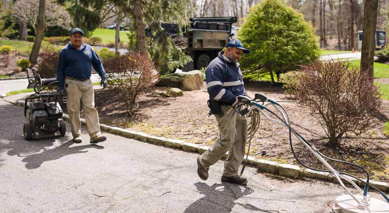 Landscape Solutions crew preparing specialized equipment illustrating tailored maintenance plans designed for each property’s unique needs