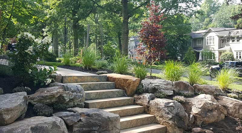 A home with boulders and stone steps