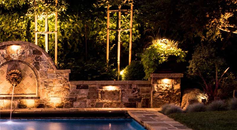 A pool area with interesting night lighting