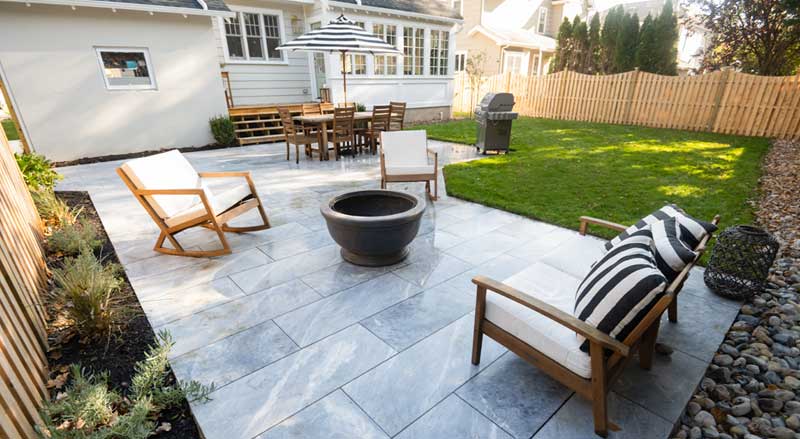 Finished backyard patio and outdoor living space following approved landscaping permits